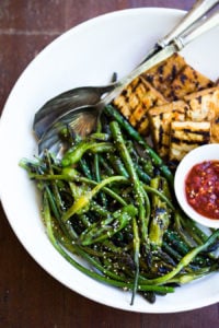 Grilled Asparagus with Garlic Scapes & Shishito Peppers tossed with a simple, Asian-Style Marinade then grilled to perfection- a vegan, gluten-free adaptable side dish, perfect for summer that can be paired with your choice of protein.