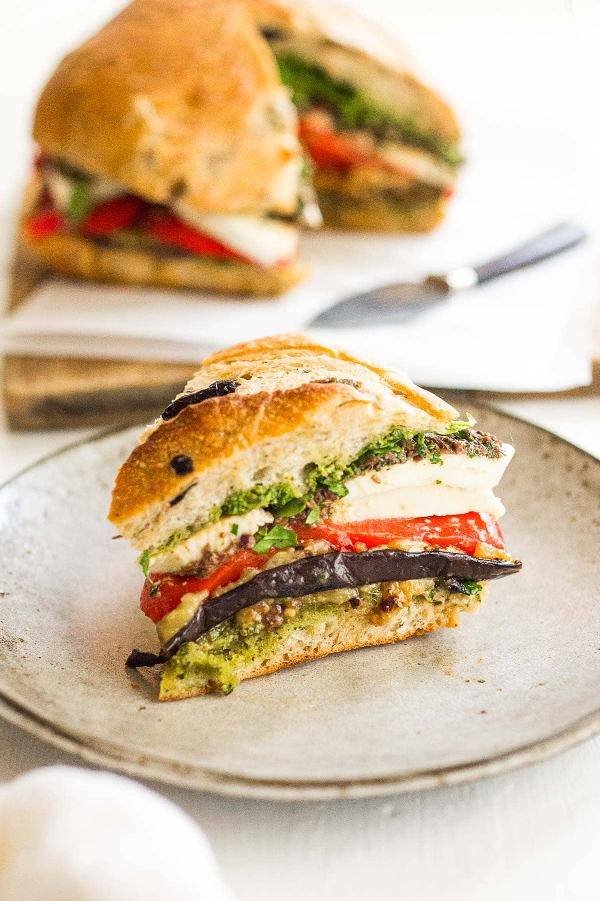 A slice of muffuletta on a plate. 