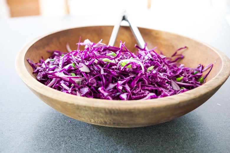 toss the salad in a bowl with the asian dressing.