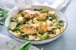 Fresh Corn Chowder with basil and white fish -a light and healthy summery dinner that can be made in under 30 minutes. Use halibut, cod, sea bass, salmon or scallops!
