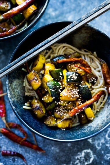 A simple delicious recipe for Kung Pao Zucchini over noodles or rice. Vegan and gluten-free adaptable! | www.feastingathome.com