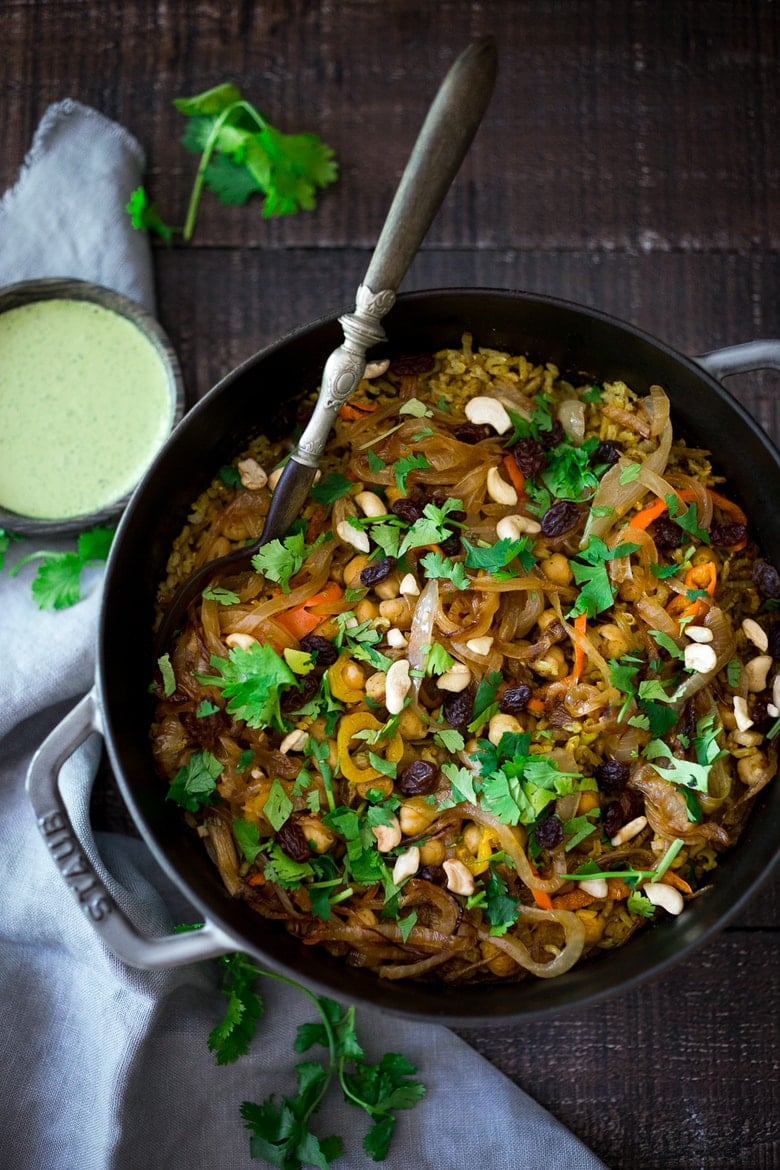 40 MOUTHWATERING VEGAN RECIPES: Quick and Easy Vegan Biryani-a fragrant Indian rice dish infused with Indian spices - vegan adaptable and gluten-free. A quick and easy weeknight meal. | www.feastingathome.com #biryani #vegandinner #veganrecipe #vegetablebiryani #veganbiryani