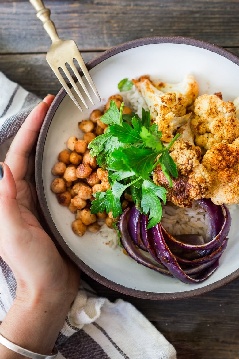 Our 25 BEST Vegan Buddha Bowls! Our 25 BEST Vegan Buddha Bowls!|Tandoori Glory Bowl with Roasted cauliflower, chickpeas, (or optional chicken.) Cook it all on one sheet-pan in 30 mins flat! Vegan, GF | #veganbowl #healthybuddhabowl #buddhabowl #vegan #cleaneating #eatingclean #eatclean #detox #cauliflower #healthybowl | www.feastingathome.com