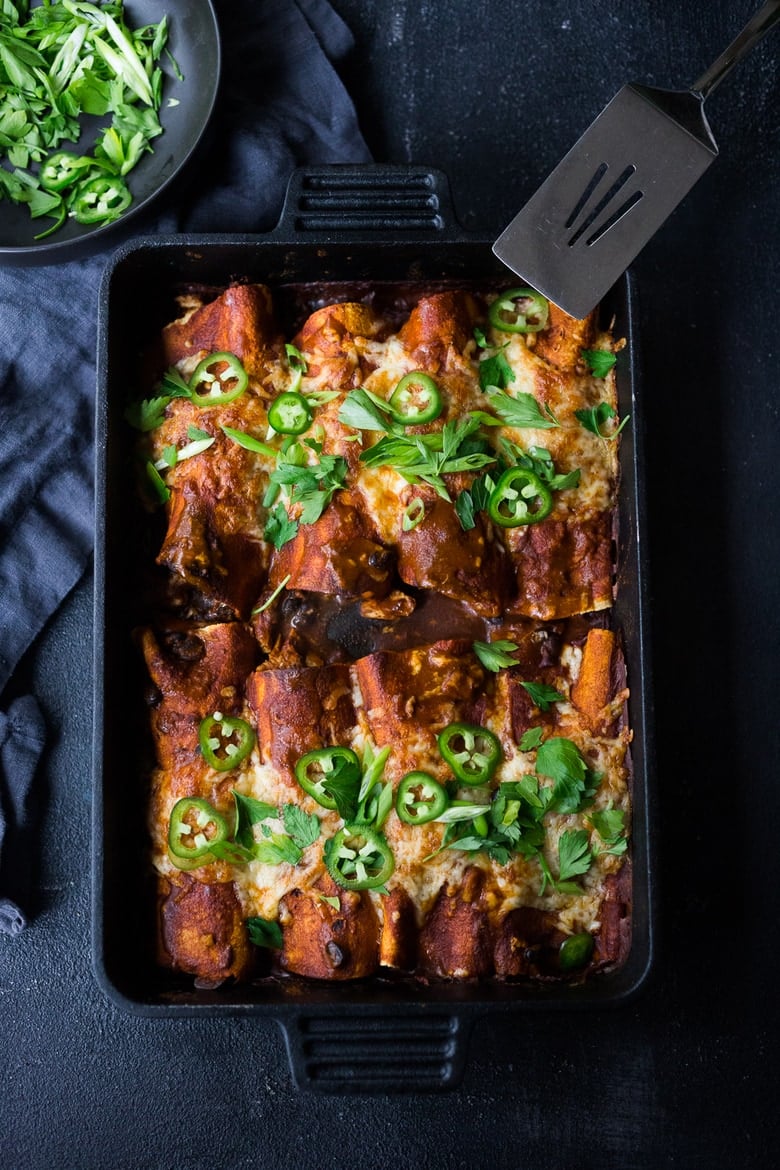 These Turkey Enchiladas with black beans are so hearty and flavorful! Make them with leftover Thanksgiving turkey and our 5-minute Homemade Enchilada Sauce. A tasty easy meal that can be eaten now, or frozen for later!