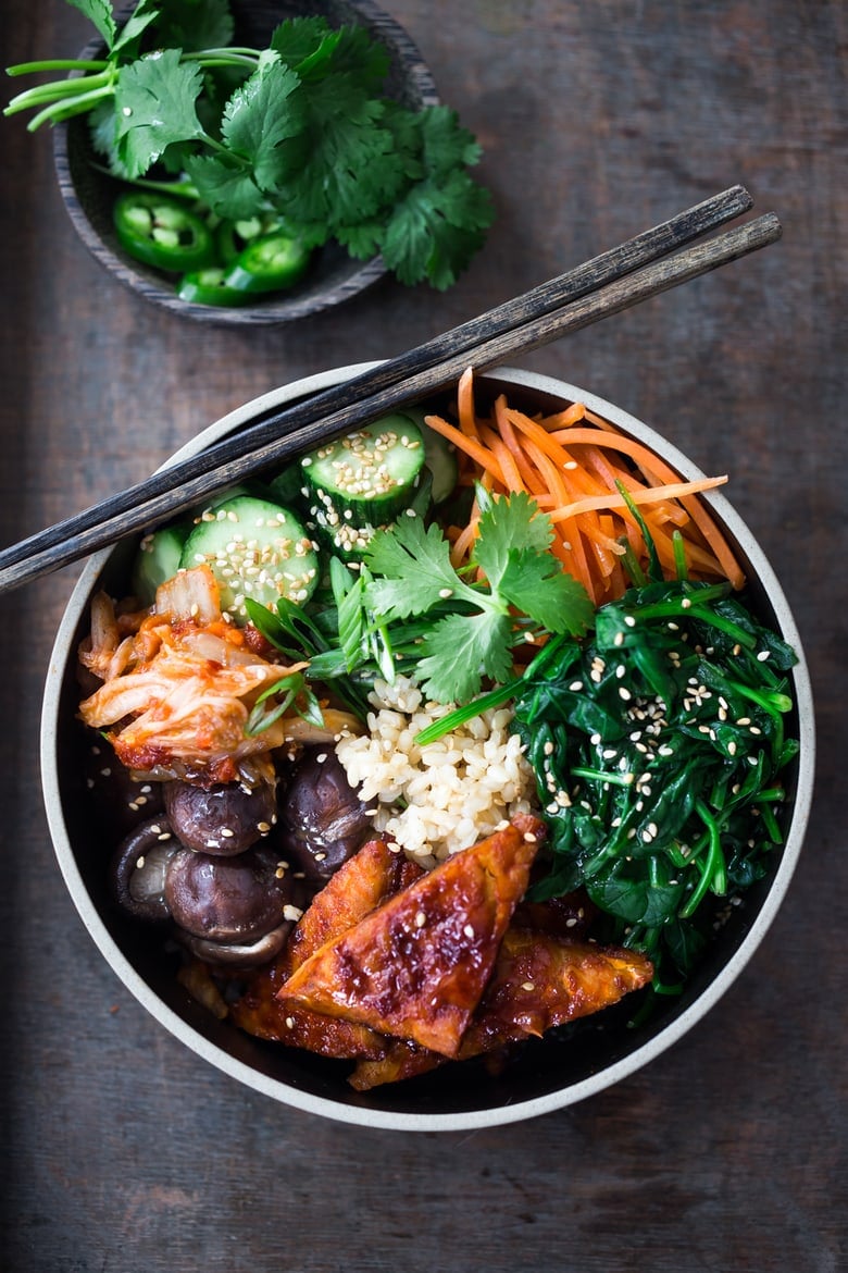 This Bibimbap recipe (aka Seoul Bowl) is made with gochujang-baked Tempeh, steamed veggies, kimchi and quick pickled cucumbers- a healthy vegan version of Bibimbap! 