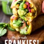 Introducing the FRANKIE! India's flavorful street food (aka Bombay Burrito) that you will fall in love with!!! This vegan version is bursting with flavor- filled with curry mashed potatoes, roasted Indian cauliflower and chickpeas, fresh spinach, mint chutney and pickled onions.| #frankie #frankies #bombayburrito #vegan #veganburrito #indianburrito #indianfood #streetfood