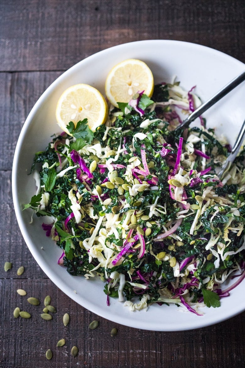 This simple Kale Slaw with Lemony Dressing can be made ahead, then used throughout the week to top off tacos, wraps, buddha bowls, burgers, and even pizza. An easy way to get in your dark leafy greens. Vegan and Gluten-Free, this amazing kale slaw keeps up to 4 days in the fridge.