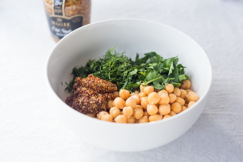 chickpea salad ingredients in a bowl. 