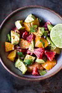 A simple delicious recipe for Orange and Avocado Salad with Lime juice, chili flakes and cilantro.