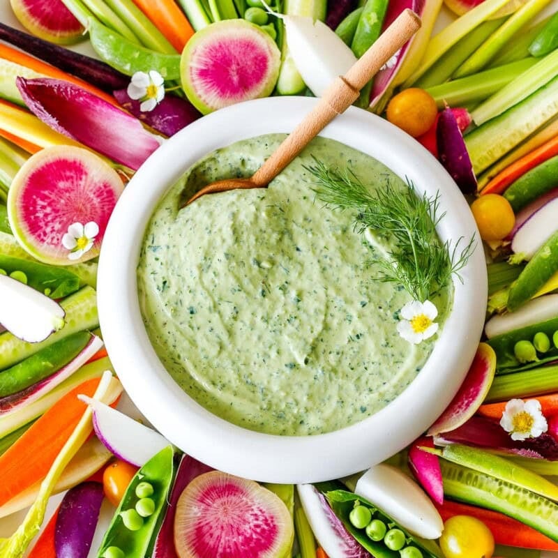 This green goddess salad dressing is so creamy and flavorful, you'll hardly know it's vegan! Made with fresh herbs, miso paste, and silken tofu! Easy to whip up and full of punchy herby flavor.