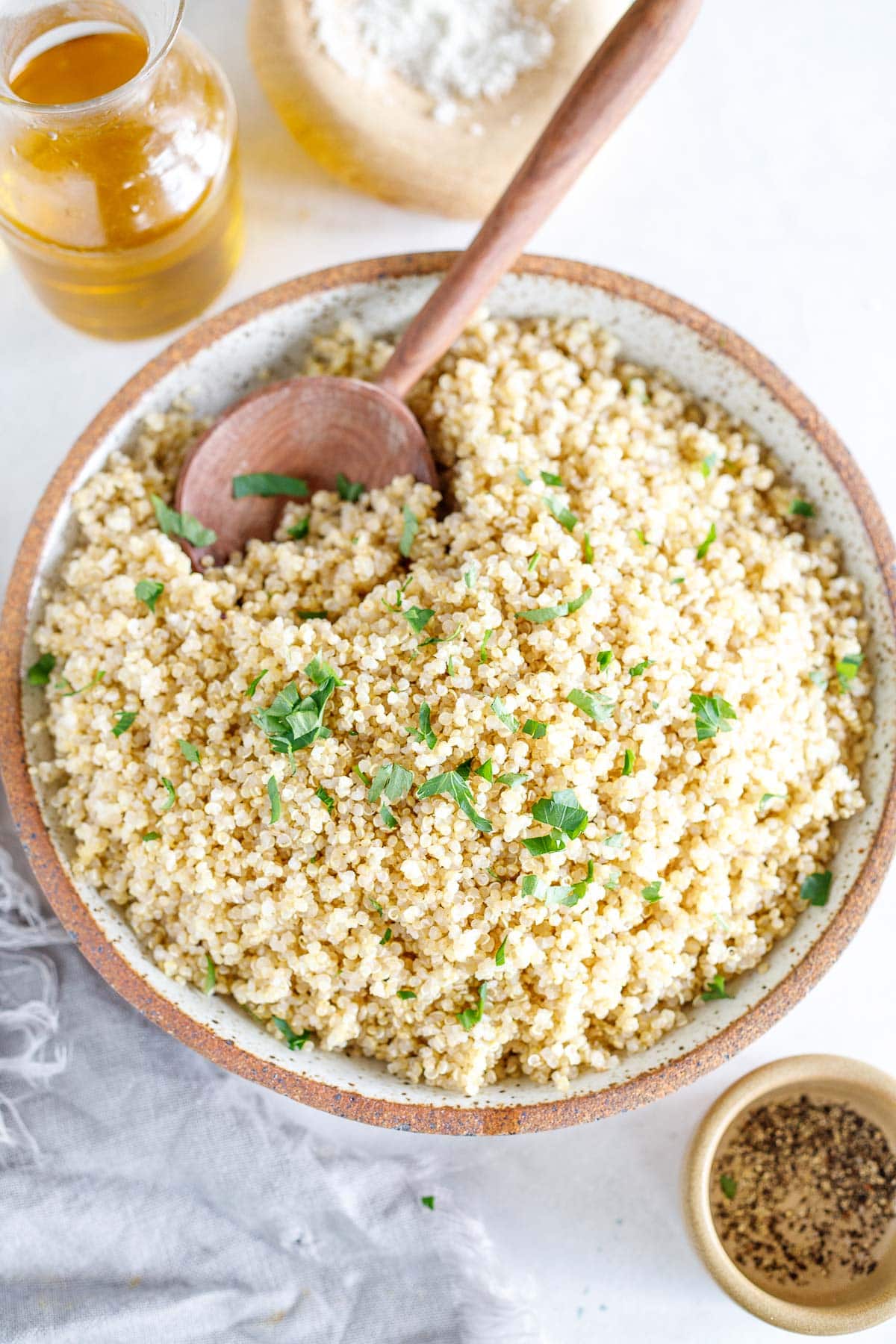 Learn how to cook perfect fluffy quinoa every time! Use in bowls, salads, wraps, or make our herby quinoa side dish. Vegan & gluten-free.