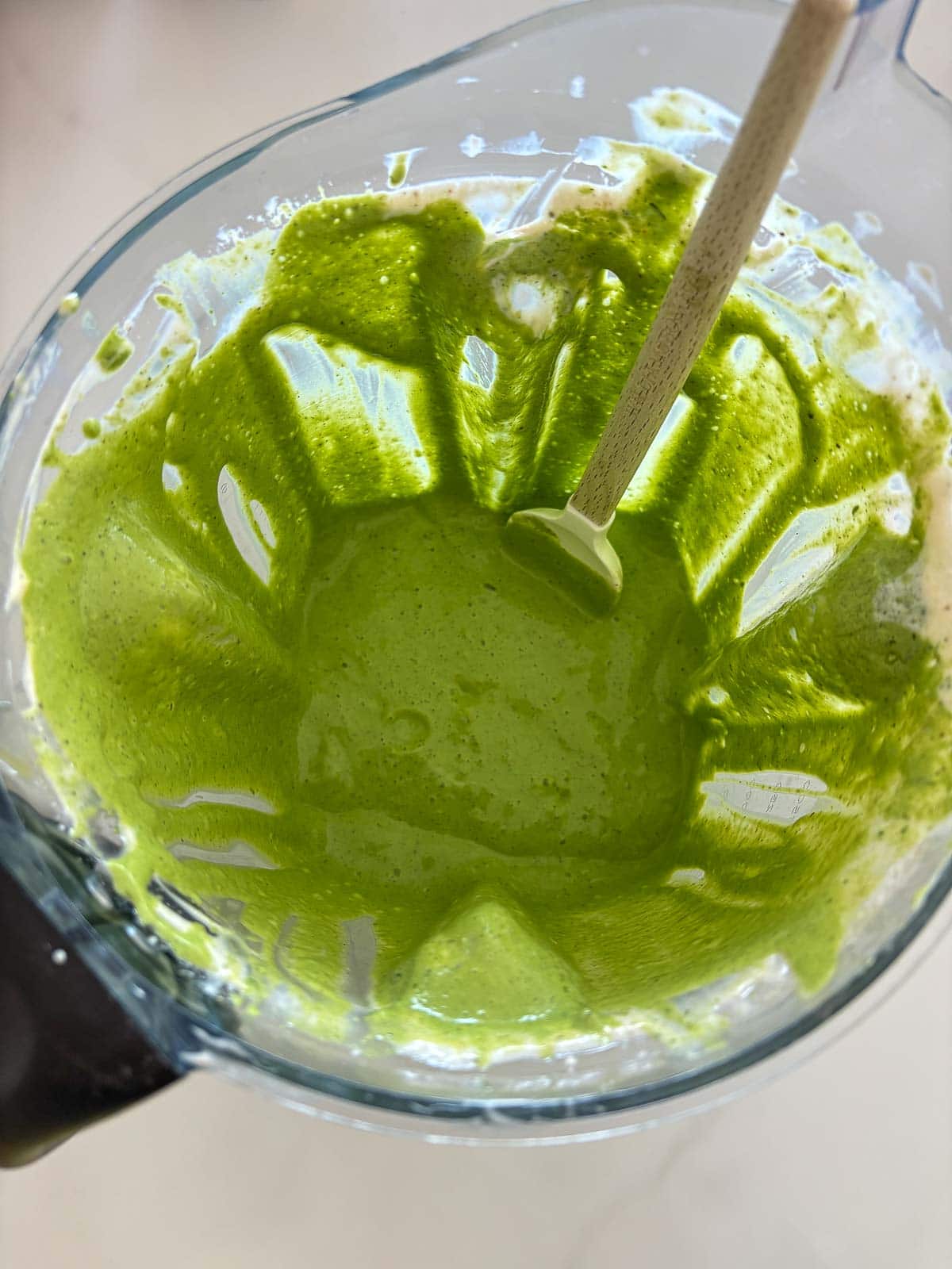 using the blender to make green goddess dressing. 