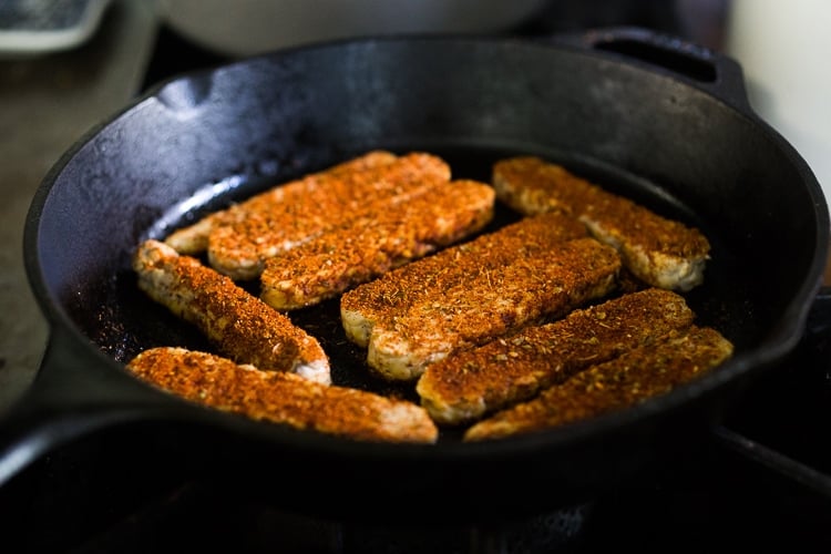 blackened cajun tempeh in cast iron skillet.