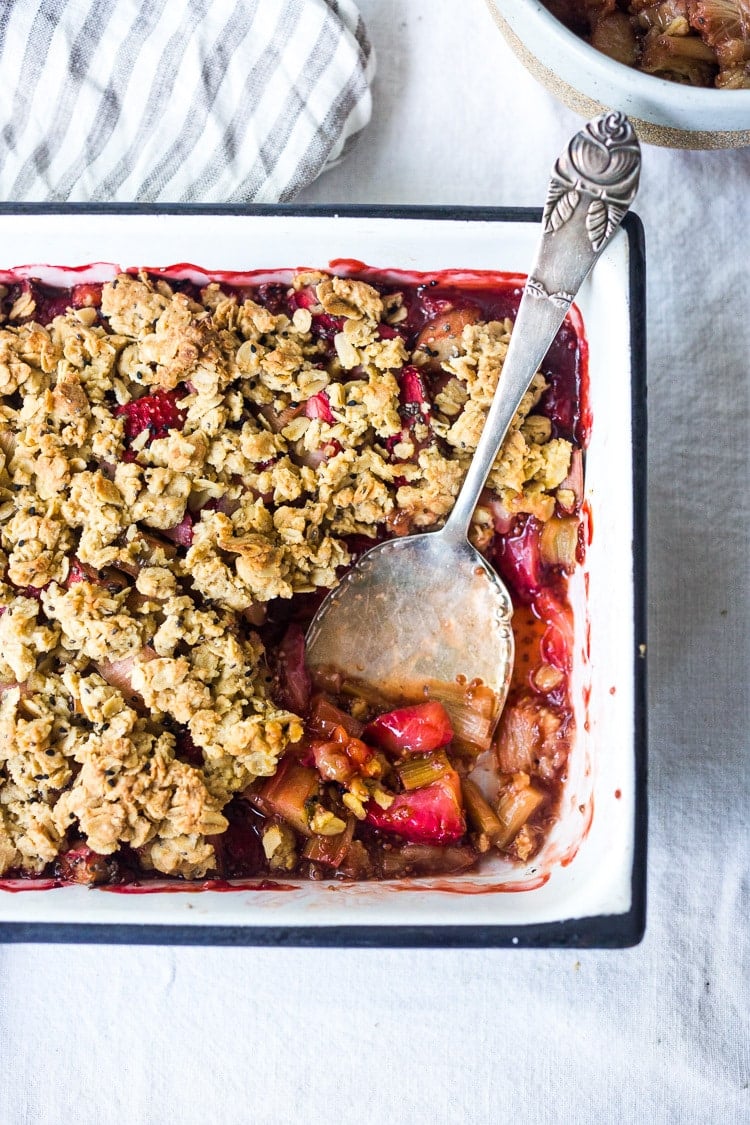 Maple-Sweetened Strawberry Rhubarb Crisp with Chia Seeds and a crumbly oat topping - a vegan, gluten-free dessert that highlights spring rhubarb. #vegan #glutenfree #crisp #rhubarb #rhubarbcrisp #rhubarbrecipes