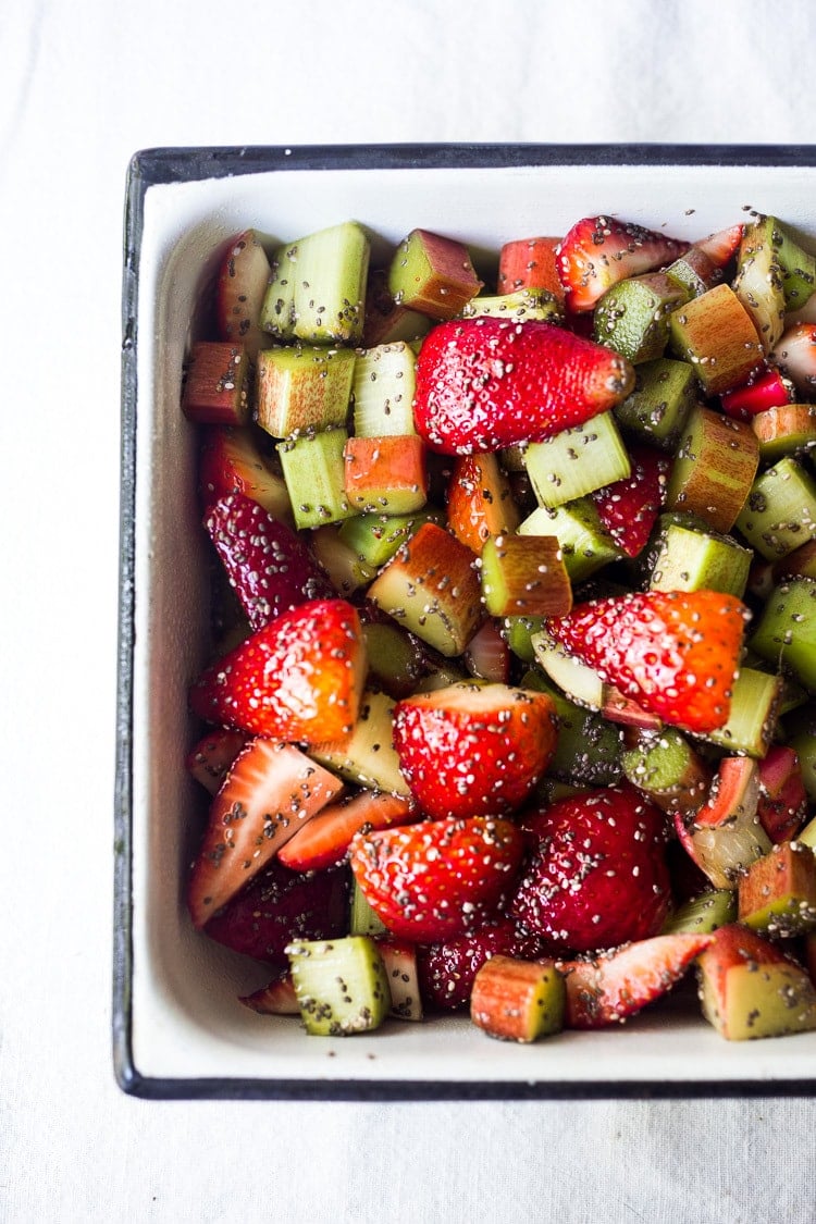 baking dish with strawberry rhubarb filling with chia seeds.