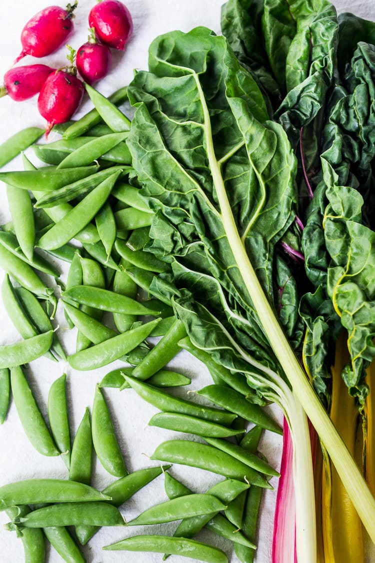 ingredients for spring lentil salad - radishes, chard, snap peas.