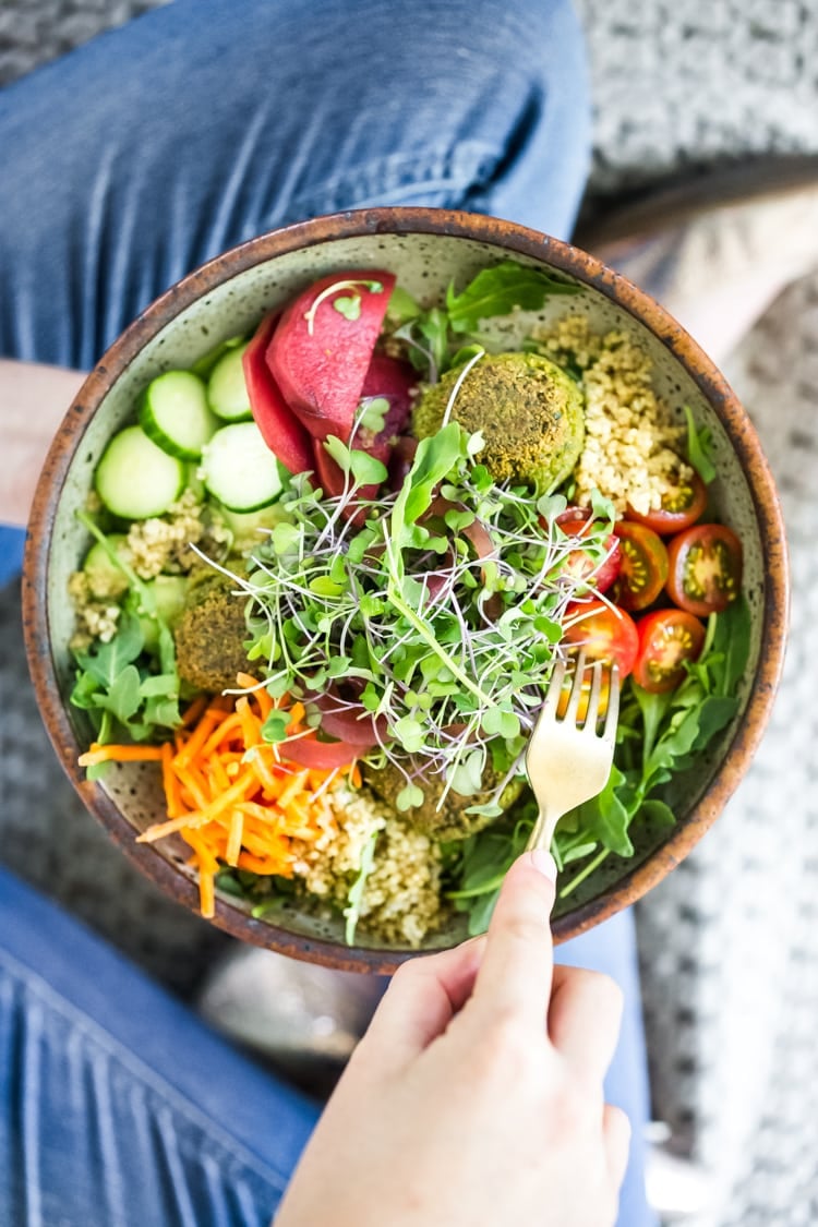 These Mediterranean Falafel Bowls are the best! Made your choice of grain, lots of healthy veggies and drizzled with tahini sauce- the falafels can be prepped ahead for the busy workweek. Vegan and Gluten-free! 