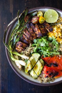 Healthy, Easy, Chipotle Grilled Chicken Salad with Grilled Corn, Peppers and Arugula, over a bed of optional quinoa with grilled scallions, avocado and a simple Chipotle Lime Dressing. Sub MEXICAN TOFU for the Chicken for a vegan version! #chipotlechicken #mexicansalad #chickensalad #grilledchicken