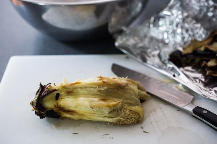 Chopping the eggplant.
