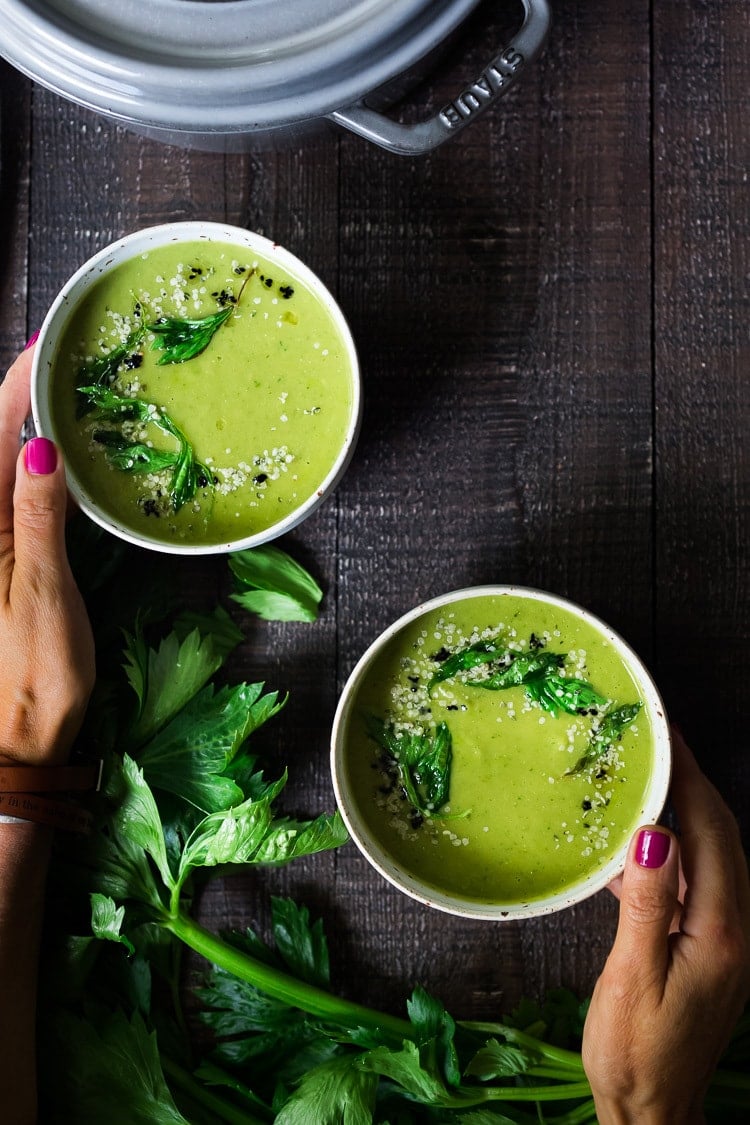 A healing bowl of Celery Soup- comforting, affordable and flavorful, that can be made in 35 minutes. Healthy, delicious and vegan adaptable! #celerysoup #celerysoup #vegan #vegansoup #healthysoup