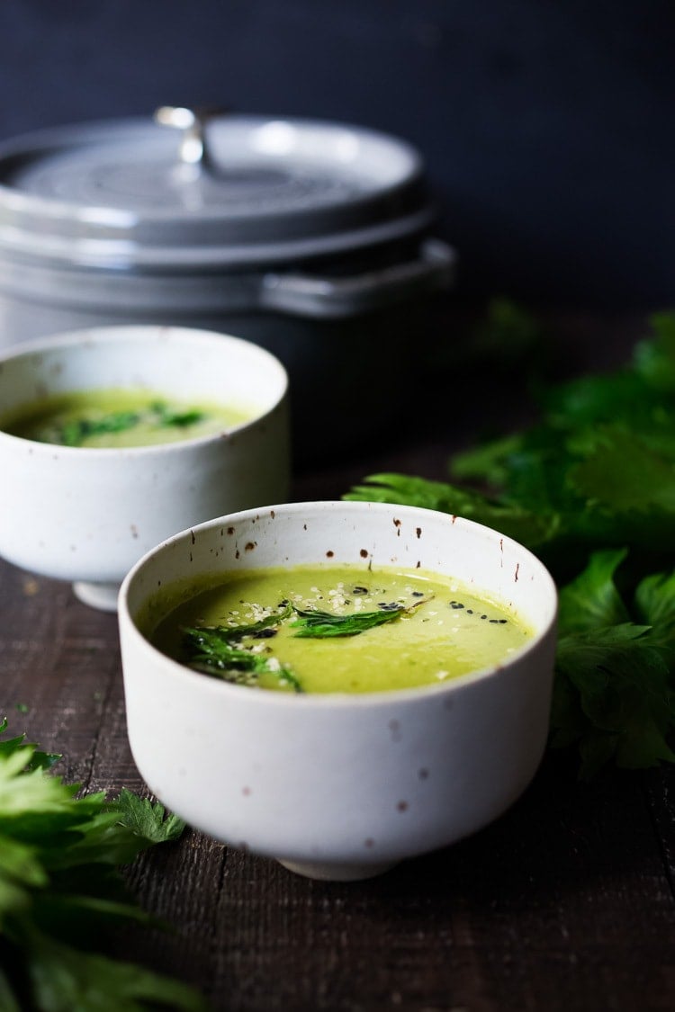 A healing bowl of Celery Soup- comforting, affordable and flavorful, that can be made in 35 minutes. Healthy, delicious and vegan adaptable! #celerysoup #celerysoup #vegan #vegansoup #healthysoup