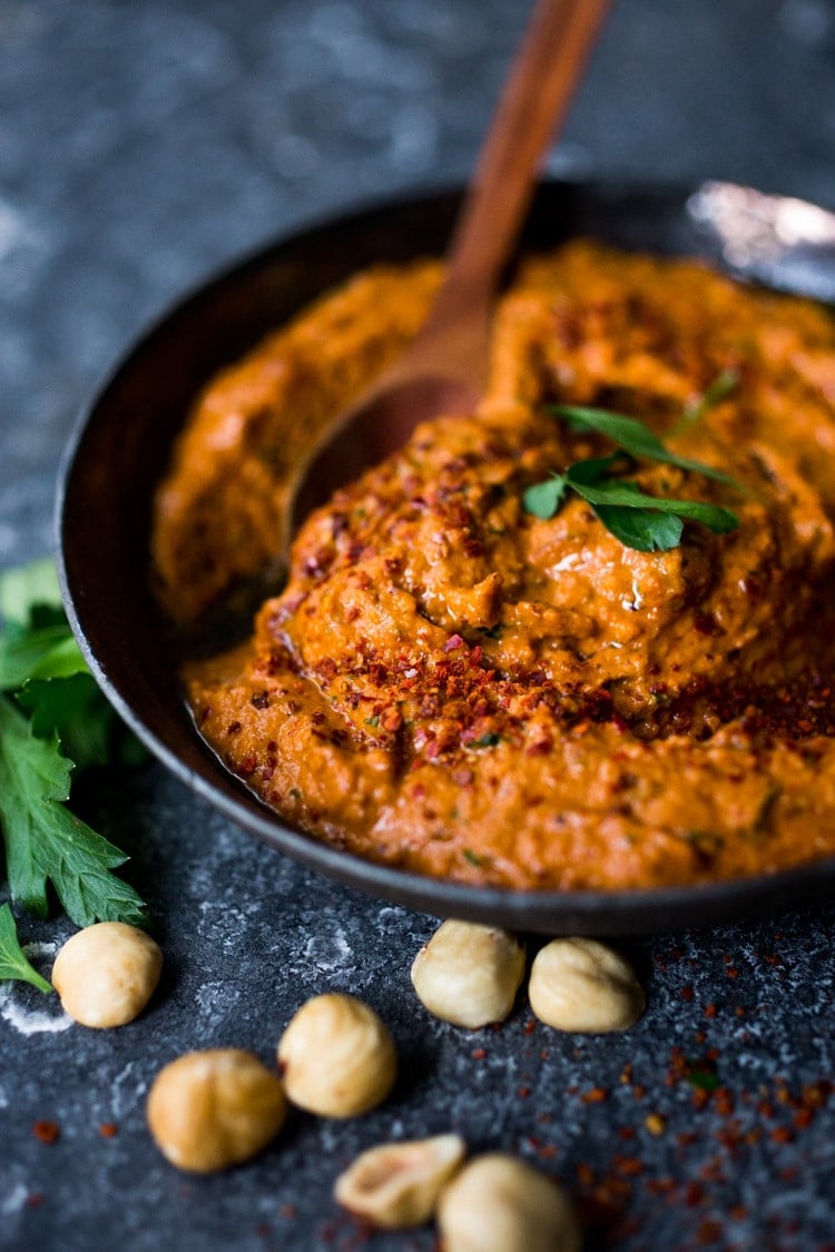 Flavorful Romesco Sauce! You'll find a million uses for this robust & flavorful Spanish condiment. Earthy, smoky and deep, it's made with simple ingredients you probably already have on hand. EASY, Vegan & Gluten-free #romesco #romescosauce #redpeppersauce #vegansauce #spanishrecipes #catalonian #spanishfood #easyromesco #plantbased #cleaneating #vegan #vegansauce 