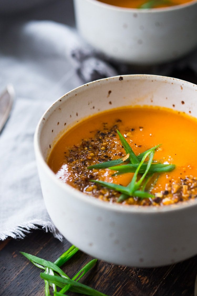 15 Minute Tomato Soup with Coconut and Ginger- a quick vegan tomato soup made with simple pantry ingredients. #vegansoup #tomatosoup #cleaneating #eatclean #veganrecipes #heatlhytomatosoup #quickrecipes #coconutsoup #plantbased #detox 