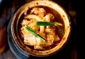 This Kimchi Recipe is quick and easy and takes only 30 minutes of hands-on time before mother nature takes over! Full of healthy, gut-healing probiotics, the benefits of eating kimchi are endless. This authentic kimchi is vegan-adaptable, gluten-free and can be made as spicy or as mild as you like!
