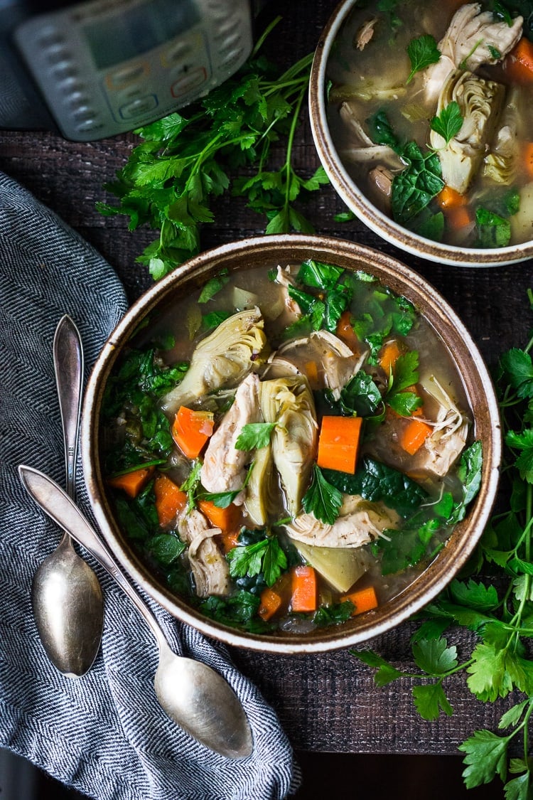 This Instant Pot Chicken Wild Rice Soup is a light and brothy soup made with artichoke hearts and vegetables, with only 15 minutes of hands-on time! A quick and easy dinner recipe you will love! This can also be made on the stovetop. Gluten-free. 