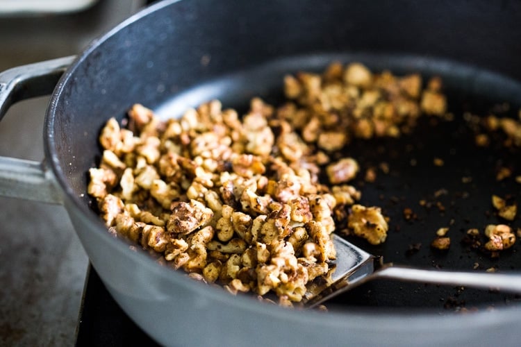 A delicious recipe for Fesenjan, a Persian Walnut Pomegranate Stew with chicken and chickpeas. Earthy, rich and tangy, this is bursting with Middle Eastern Flavor! #persianstew #fesenjan #persianrecipes #persiancchicken #middleeastern #chicken #chickpeastew