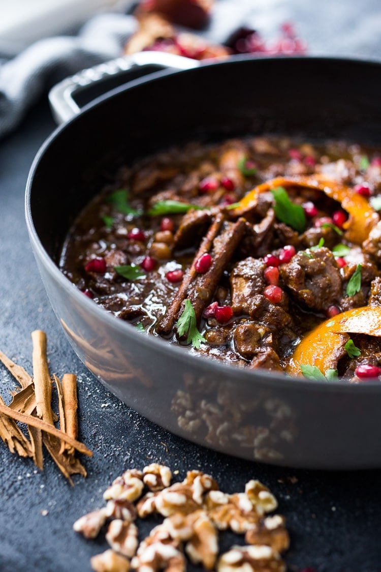 A delicious recipe for Fesenjan, a Persian Walnut Pomegranate Stew with chicken and chickpeas. Earthy, rich and tangy, this is bursting with Middle Eastern Flavor! #persianstew #fesenjan #persianrecipes #persiancchicken #middleeastern #chicken #chickpeastew