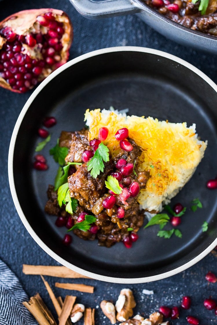 A delicious recipe for Fesenjan, a Persian Walnut Pomegranate Stew with chicken and chickpeas. Earthy, rich and tangy, this is bursting with Middle Eastern Flavor! #persianstew #fesenjan #persianrecipes #persiancchicken #middleeastern #chicken #chickpeastew