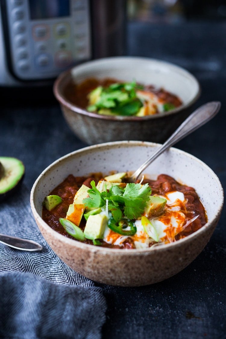 This hearty Instant Pot Chili recipe is made with dried beans and your choice of ground meat (beef, turkey or chicken) or try vegan soy crumbles! Vegan-adaptable! Serve it up with Our Favorite Homemade Cornbread. Video.