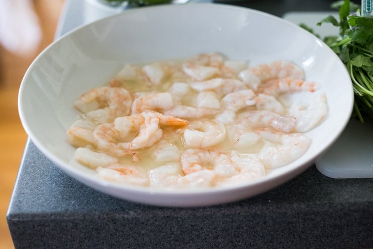 Authentic Aguachile Recipe! Similar to ceviche, shrimp is cooked in a mixture of lime juice, chiles and cilantro. Flavorful, simple and sooooo delicious! #aguachile #shrimp #verde #ceviche #Mexican
