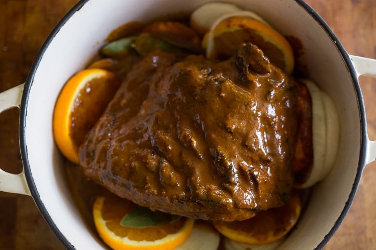 Tender, slow‑cooked lamb in smoky‑orange marinade— in a dutch oven.
