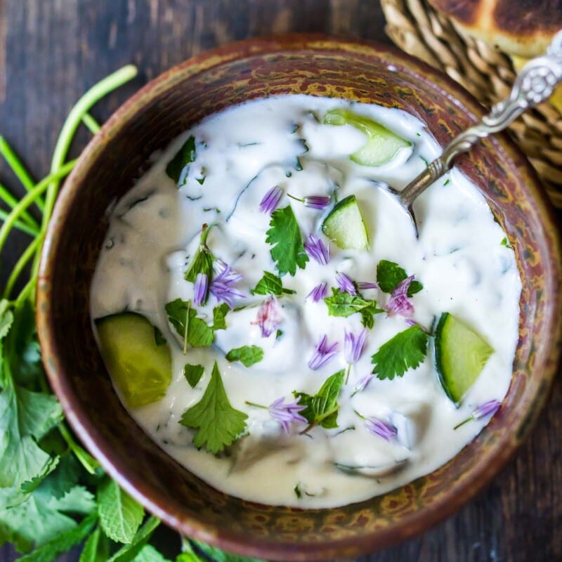 INGREDIENTS IN RAITA This version of Raita is made with plain yogurt, fresh cucumber, fresh mint and cilantro and spices. There are many variations in India and many other kinds of Raita, not just Cucumber Raita, but here is a basic recipe that most are familiar with. HOW TO MAKE RAITA IN 2 EASY STEPS! Prep the ingredients (cut the onion, cucumber & herbs) and place in a bowl with the yogurt and spices. Stir! Riata will keep in the fridge for up to 4 days.