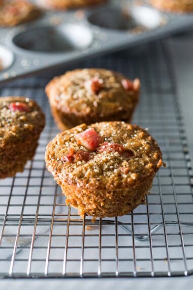 Whole grain, Rhubarb Muffins- a simple, healthy one-bowl muffin recipe made with oats, your choice of flour, optional seeds and nuts, sweetened with maple syrup. Vegan and GF adaptable! 