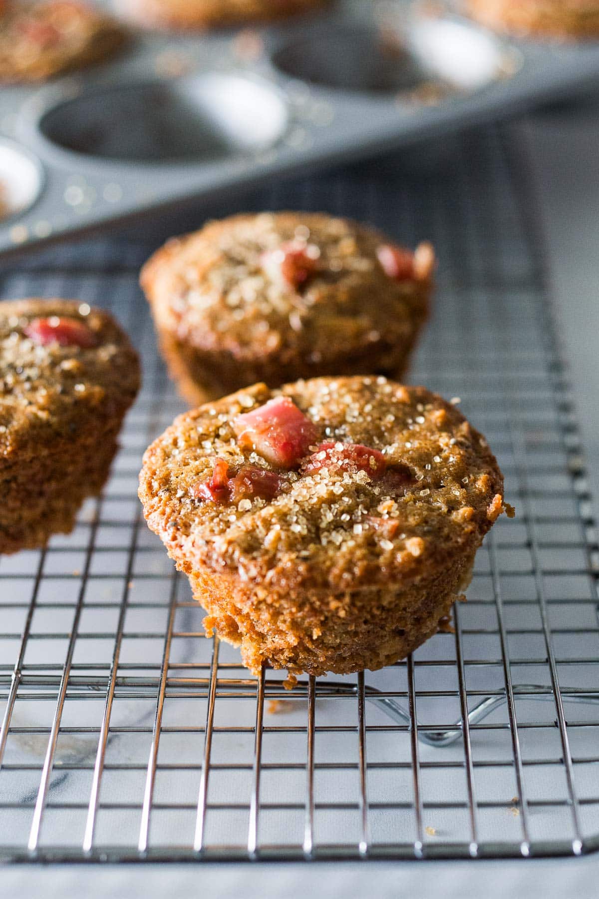 Whole grain, Rhubarb Muffins- a simple, healthy one-bowl muffin recipe made with oats, your choice of flour, optional seeds and nuts, sweetened with maple syrup. Vegan and GF adaptable! 