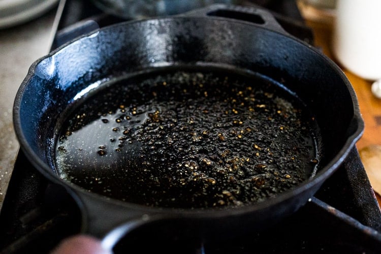 cast iron skillet with oil seasoned with salt and pepper.