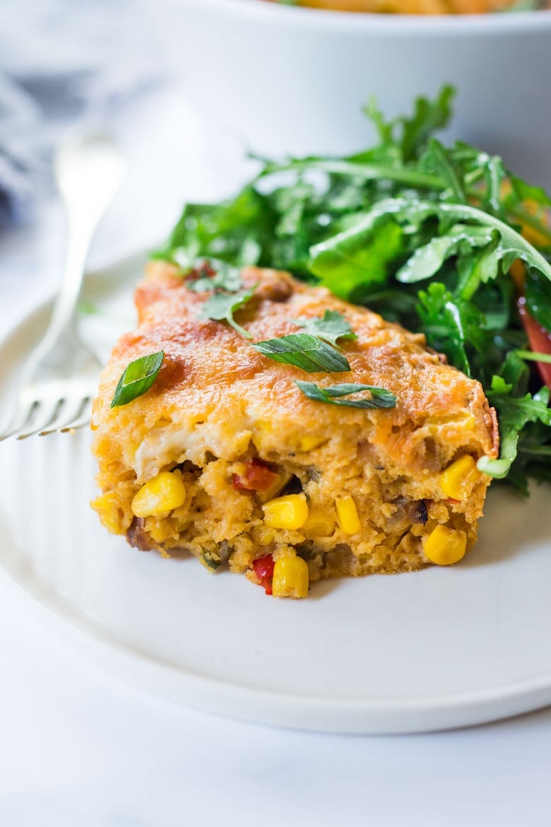 Cornbread Casserole! Seasoned with Mexican spices and filled with healthy veggies and cheddar cheese, this easy corn casserole can be put together in just 20 minutes before baking in the oven. #weeknightdinner #weeknightmeal #vegetariandinner #vegetarian #cornbread #corncasserole #cornbreadcasserole