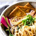 Vegan Ramen with Miso Shiitake Broth- an easy healthy ramen with mushrooms, tofu, Bok Choy and scallions. Plus a simple tip to making this "creamy". #veganramen #easyramen #bestramen #vegetarianramen #ramen