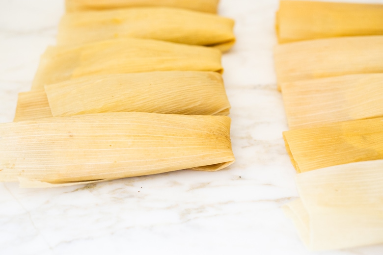 rolled tamales on the counter. 