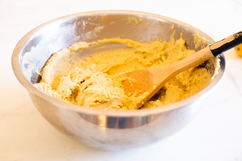 whisking the masa filling for tamales. 