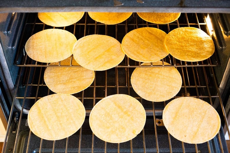 Making homemade tortilla chips for chilaquiles. 