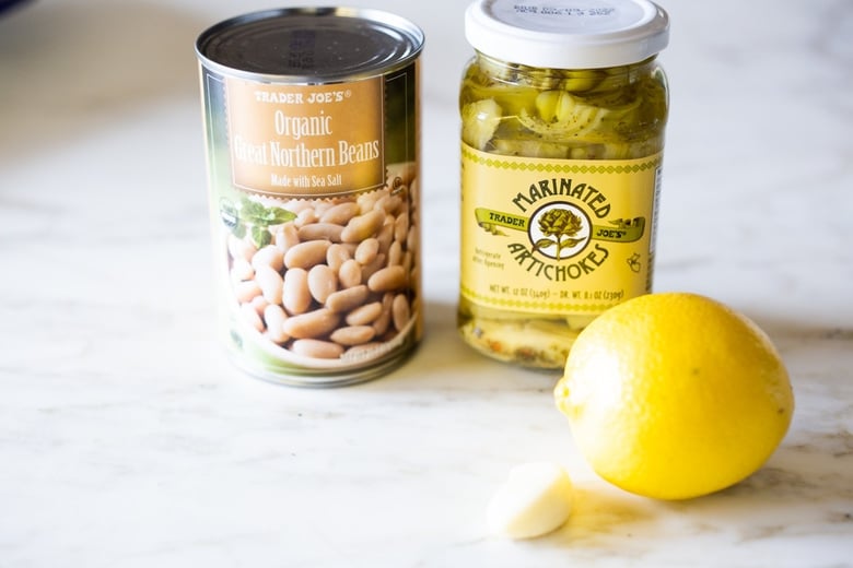 Lemony Artichoke White Bean Dip - a quick and easy Vegan Appetizer (a twist on "hummus") that can be made in 10 minutes flat. Great for parties and gatherings and made with simple pantry ingredients!
