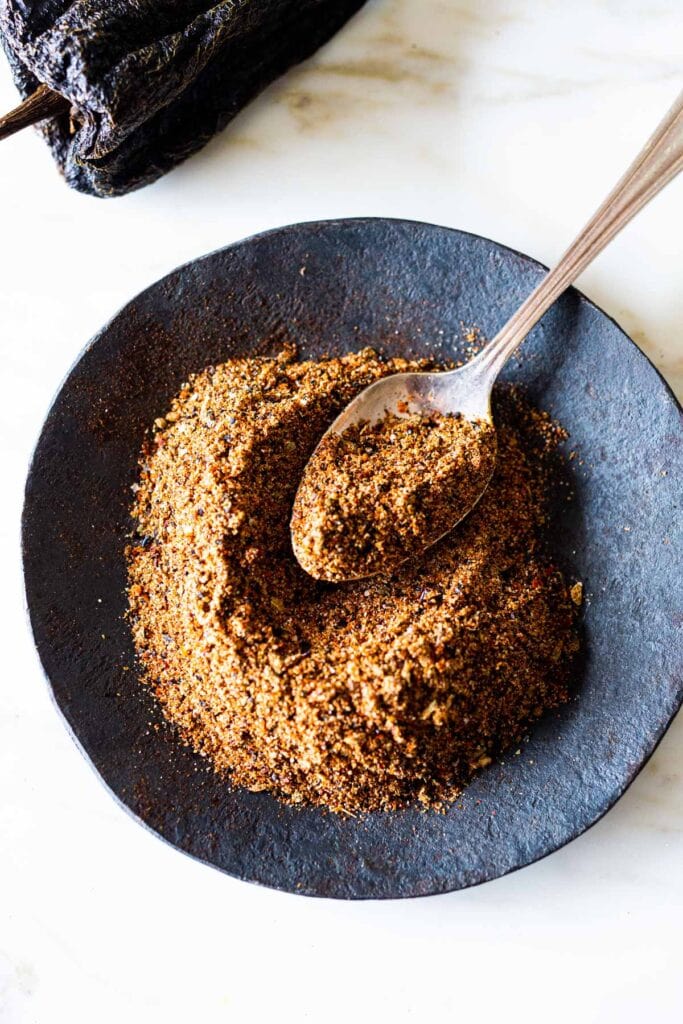 small dish with homemade taco seasoning, with spoon.