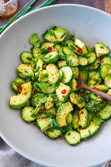 This avocado salad recipe is incredibly flavorful! It's made with creamy, ripe avocados, crisp cucumbers, scallions, sesame seeds, and cilantro in a Japanese-style dressing. It's a delicious side salad any time of year! Vegan. 