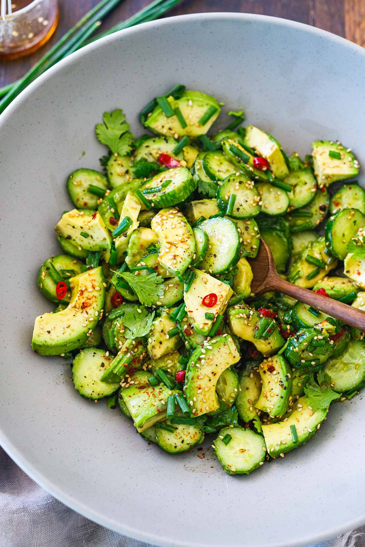 This avocado salad recipe is incredibly flavorful! It's made with creamy, ripe avocados, crisp cucumbers, scallions, sesame seeds, and cilantro in a Japanese-style dressing. It's a delicious side salad any time of year! Vegan. 