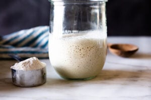 How to make your own Sourdough Starter, using simple ingredients with no special equipment, in 5-8 days, that can be used in crusty bread, pizza dough, waffles, pancakes, and rolls- instead of using yeast. Sourdough Starter is "wild" yeast, made from flour and water and the wild yeast in the air around us.