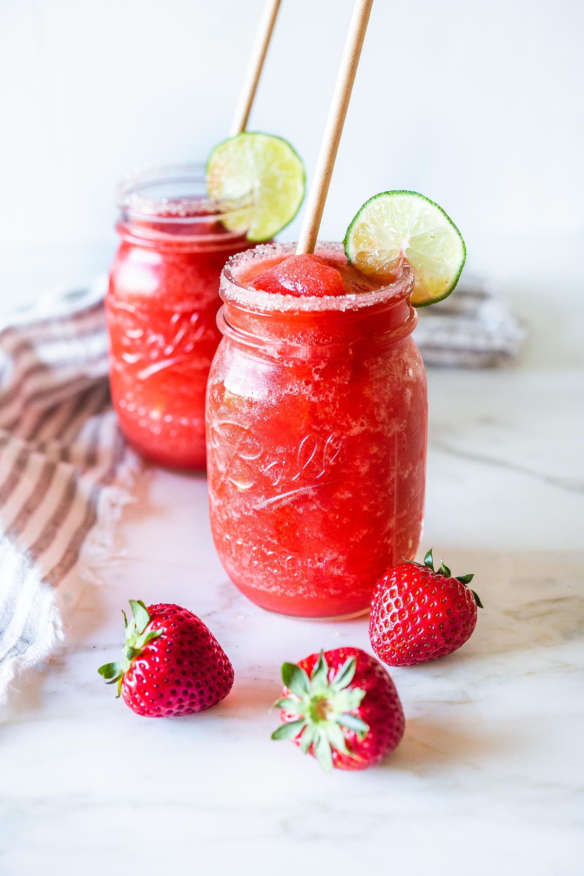blended fresh strawberry margaritas in a mason jar.
